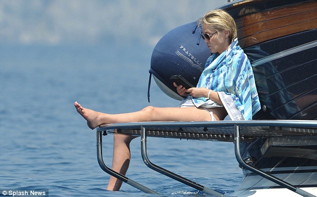 Sharon Stone,55, shows she’s still got it as she soaks up the sun in white bikini in Italy
