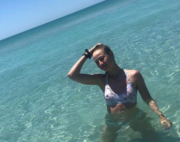 Nelly Korda shows off bum in tiny thong bikini as fans tell ‘it has its own personality’